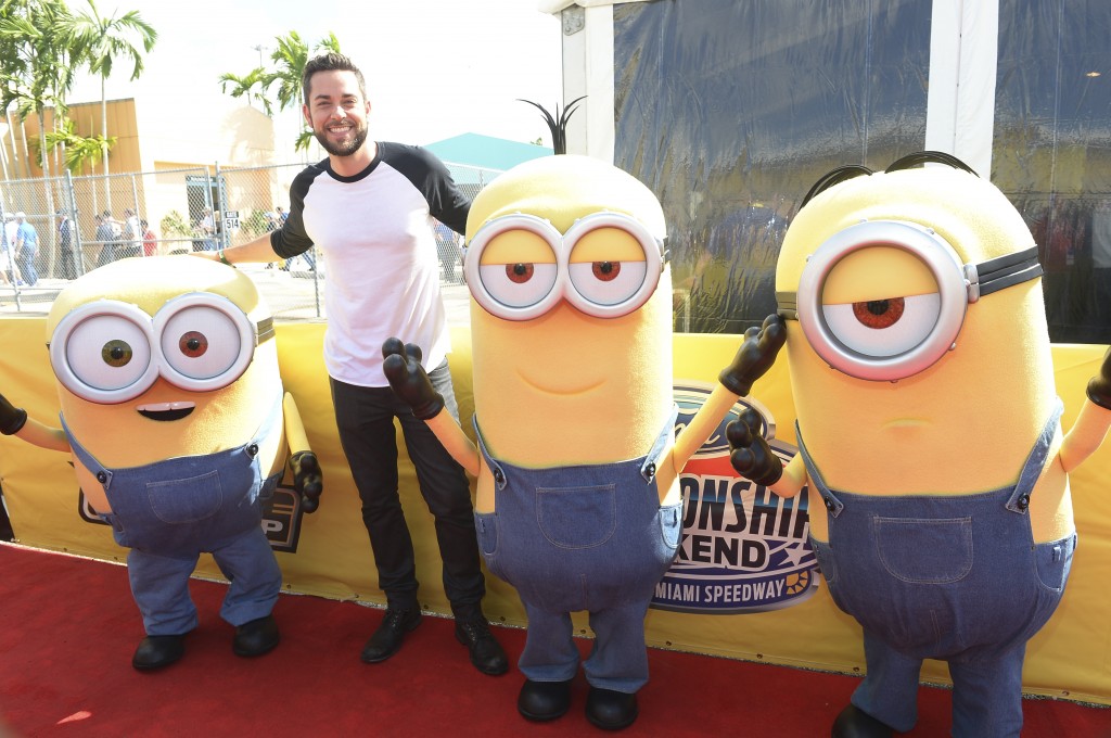 HOMESTEAD, FL - NOVEMBER 22: Zachary Levi with the Minions at NASCAR Ford Championship Weekend in celebration of the Minions on digital HD on November 24 and Blu-ray & DVD on December 8, on November 22, 2015 in Homestead, United States. (Photo by Gustavo Caballero/Getty Images For Universal Pictures Home Entertainment)